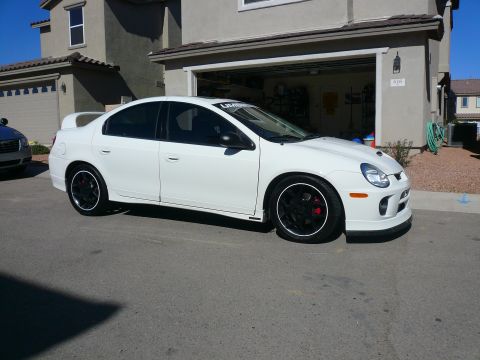 1996 Ford Probe - Modified white Dodge Neon SRT-4 with aftermarket wheels and body kit.