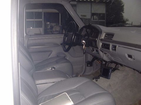 1994 Ford Bronco - Interior view of a 1992 Ford Bronco, with gray leather seats and dashboard visible.