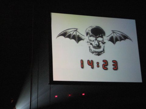 1988 Ford Bronco - A projection screen displays a skull with bat wings and a digital clock reading 14:23.