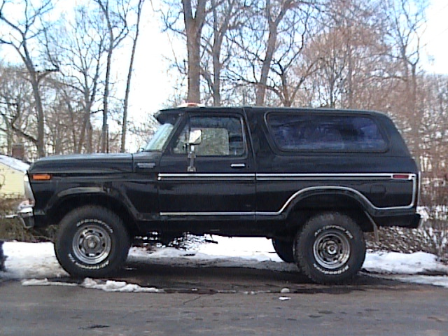 Side view of a black Ford Bronco with chrome trim and BFGoodrich tires