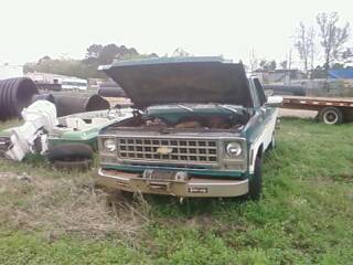 1979 Chevrolet Cheyenne - Front view of a 1977 Chevrolet pickup truck with its hood open, parked outdoors.