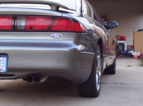 1995 Ford Probe - The rear of a 1995 Ford Probe shows its taillights, Ford emblem, and dual exhaust pipes.