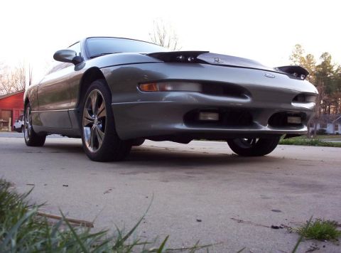 1995 Ford Probe - This Ford Probe is shown from a low angle, highlighting its front end and custom wheels.