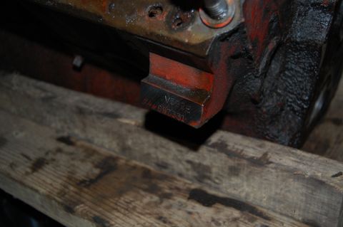 1994 Ford Bronco - Close-up of an engine block showing stamped identification numbers V890E and 444997531.