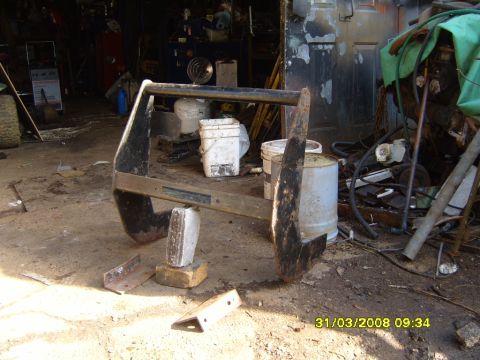 1989 Ford Bronco - A heavy-duty winch mount bumper is shown in a workshop setting.