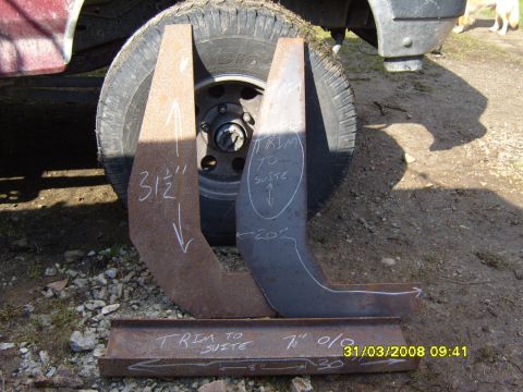 1989 Ford Bronco - Custom metal parts for a winch mount are shown with measurements, placed near a vehicle tire.