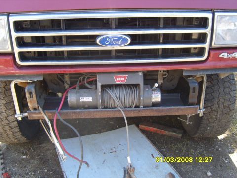 1989 Ford Bronco - Front view of a 1989 Ford Bronco showing the grille and a WARN winch installation.