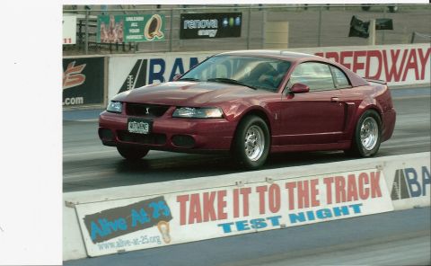 1979 Ford Bronco - This red 1999 Ford Mustang Cobra is on the drag strip, ready for a test night.