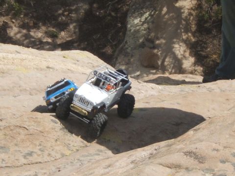 1988 Ford Bronco - RC rock crawlers navigate a challenging, rocky outdoor course.