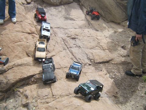 1988 Ford Bronco - RC rock crawlers tackle a challenging terrain at Vasquez Rocks, with participants controlling the vehicles remotely.