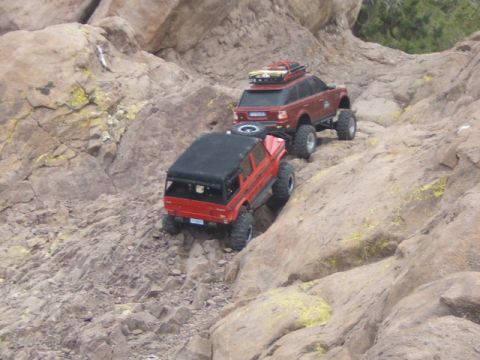 1988 Ford Bronco - RC crawlers navigate a challenging rocky terrain, their off-road capabilities.