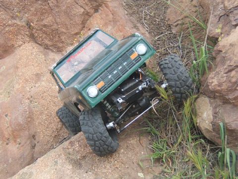 1988 Ford Bronco - RC 1988 Ford Bronco model navigating a rocky obstacle course.