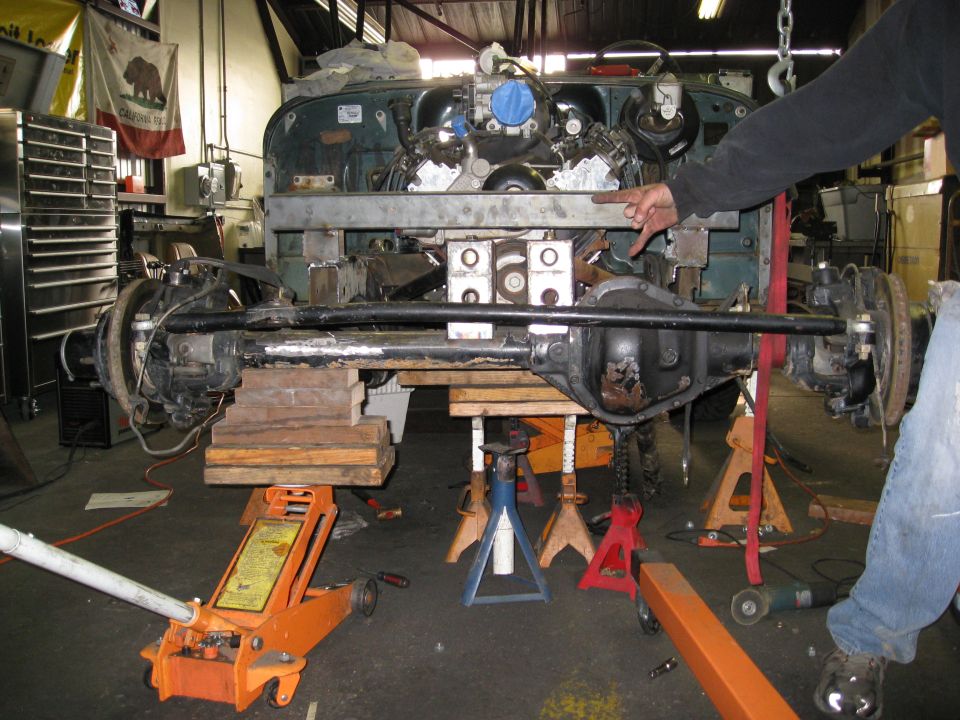 Jeep YJ chassis undergoing engine and suspension work