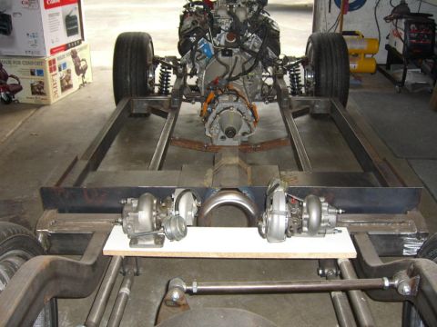 1964 Ford Ranchero - This image shows a custom vehicle chassis with the engine and transmission installed, along with two turbochargers.