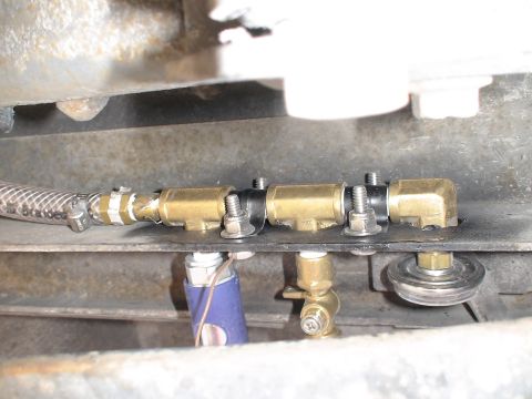 1993 Ford C-350 (Centurion Conversions) - Brass fittings and a blue hose are visible in this close-up of an air brake system component.