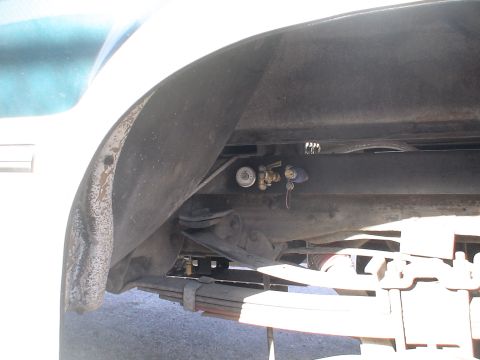 1993 Ford C-350 (Centurion Conversions) - Close-up of an air brake system gauge and valve assembly, likely part of a truck's air system.