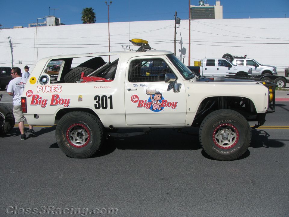 White race truck number 301 with Big Boy and Pike's decals, side view