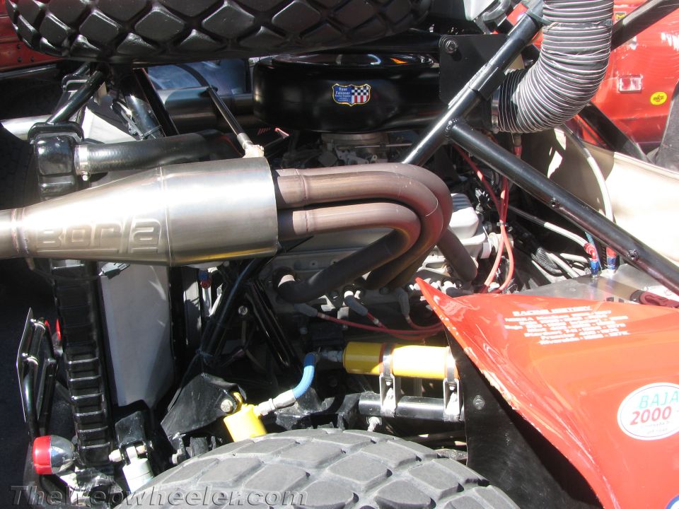 Close-up of a Borla exhaust and engine bay on an off-road buggy