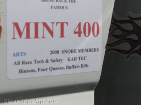 1990 Ford Bronco - Photographed MINT 400 sponsor/event decal on a race vehicle listing SNORE members and sponsors, not a technical document.