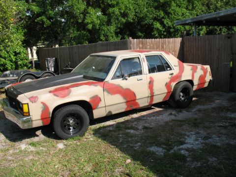 1985 Ford LTD Crown Victoria - This sedan has a unique camouflage paint scheme applied to its exterior.