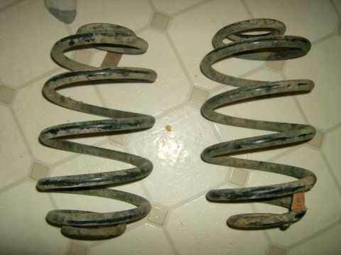2004 Jeep Wrangler - A pair of used coil springs are shown resting on a tiled surface.