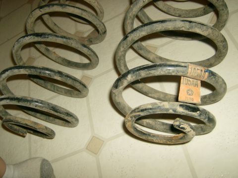2004 Jeep Wrangler - Coil springs with a Mopar label are shown, but the vehicle year is not identifiable from this image.