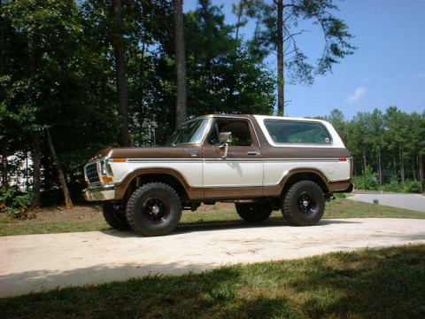 1978 Ford Bronco - This 1978 Ford Bronco is parked outdoors on a dirt path, surrounded by trees.
