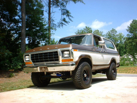 1978 Ford Bronco - This classic Ford Bronco is shown from a three-quarter front view, highlighting its two-tone paint scheme and tires.