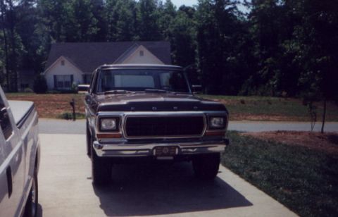 1978 Ford Bronco - This 1978 Ford Bronco is parked in a driveway, with another vehicle to its left.