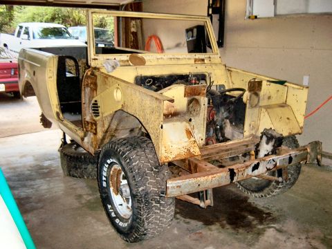 1966 International Scout 800 - This heavily rusted 1966 International Scout 800 body is undergoing restoration work.