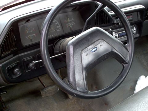 1989 Ford F-350 - Interior of a Ford truck, likely from the late 1980s, with visible dashboard and steering wheel.