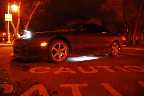 1993 Ford Probe - Night shot of a 1993 Ford Probe showing its pop-up headlights and underglow.