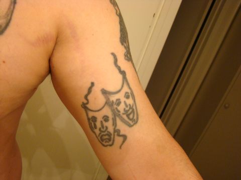 1989 Ford Bronco - A tattoo of theater masks is visible on an arm.