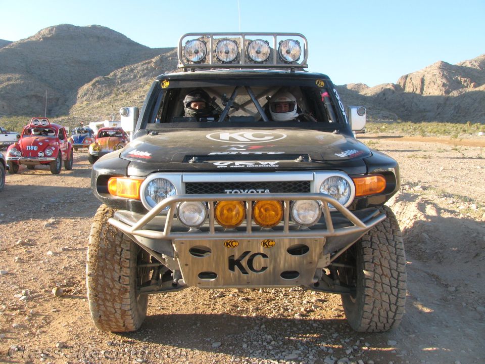 Black Toyota FJ Cruiser off-road race truck front view with KC lights