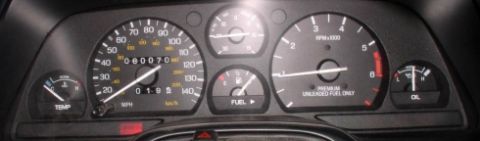1994 Ford Thunderbird - Interior view of a vehicle's dashboard gauges, including the speedometer, tachometer, fuel, oil, and temperature indicators.