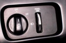 1994 Ford Thunderbird - Close-up of the interior light controls, showing the headlight switch and dimmer.