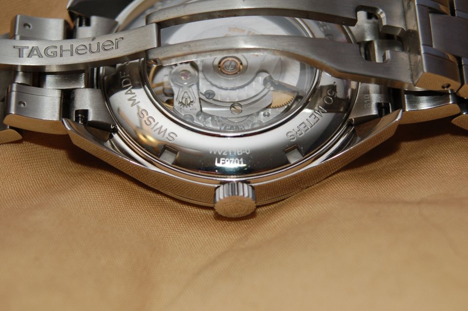 Exhibition caseback of a stainless TAG Heuer automatic watch showing its movement