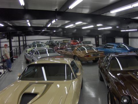 1979 Chevrolet Camaro - A collection of cars, possibly from the late 1970s or early 1980s, are displayed indoors.