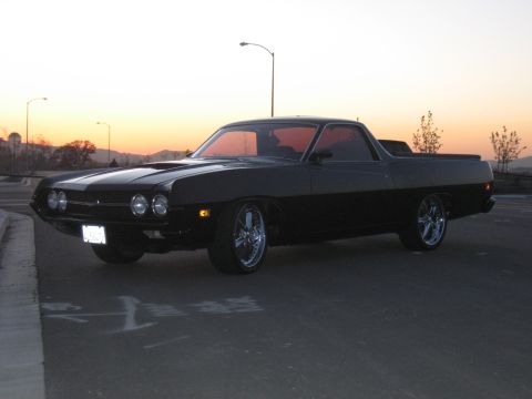 1970 Ford Ranchero - This classic Ranchero has a two-tone paint job and chrome wheels, seen during golden hour.