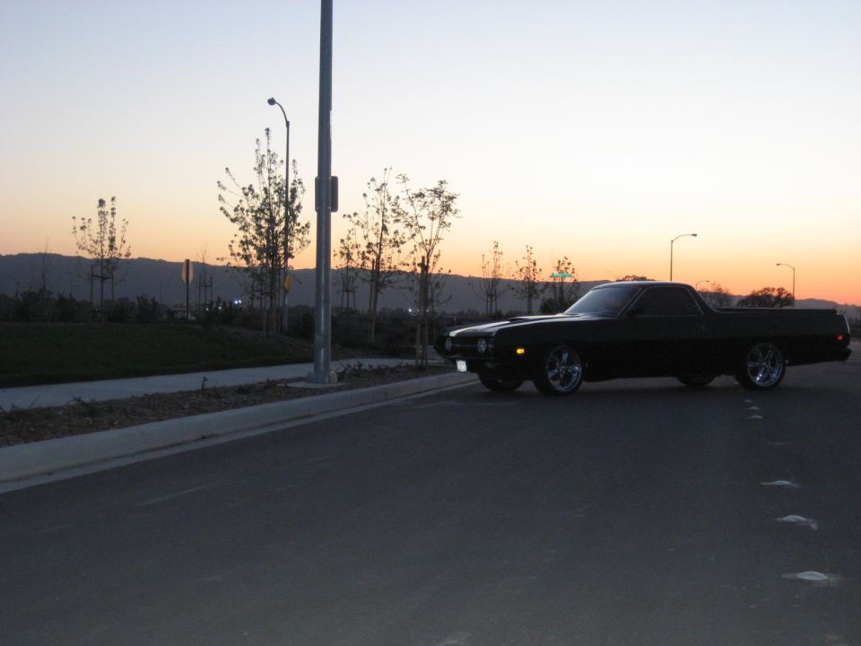 Black 1970 Ford Ranchero 3q-front view at sunset