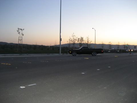 1970 Ford Ranchero - Side view of a 1970 Ford Ranchero pickup truck during sunset.