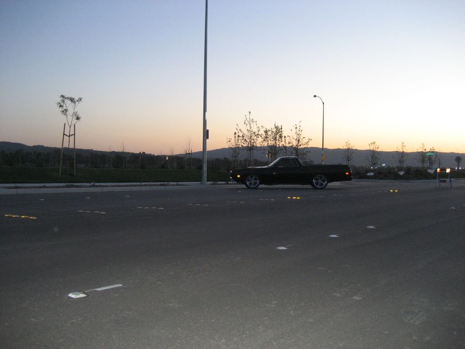 1970 Ford Ranchero parked on asphalt at dusk