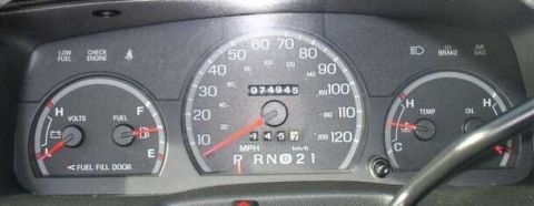 1999 Ford Crown Victoria - Dashboard gauges of a 1999 Ford Crown Victoria show mileage and fuel level.