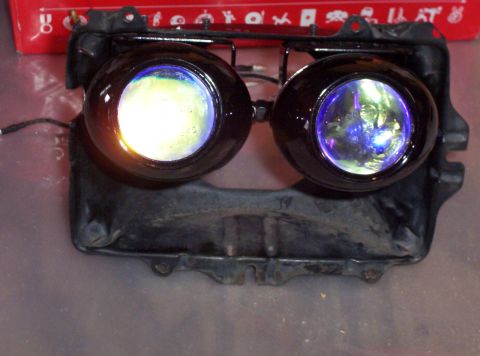 1995 Ford Probe - Aftermarket projector headlights with black housings are shown.