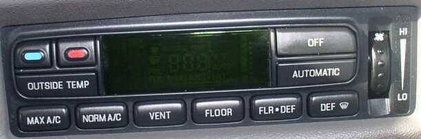 Car climate control panel with buttons for MAX A/C, NORM A/C, VENT, FLOOR, FLR DEF, DEF, OUTSIDE TEMP, OFF, AUTOMATIC, and a fan speed dial