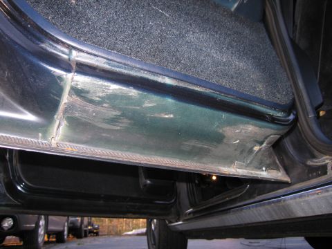 1991 Ford LTD Crown Victoria - Interior view of a car's door sill, showing signs of wear and tear.