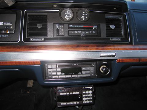 1991 Ford LTD Crown Victoria - The interior dashboard features a Ford CD player, dual gauges, and a Motorola radio unit.