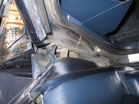 1991 Ford LTD Crown Victoria - Interior view of a car's door jamb, revealing structural components and seals.