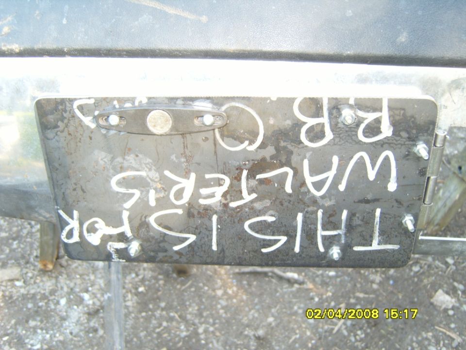 Metal plate with white painted text: THIS IS FOR WALTERIS R.B. C