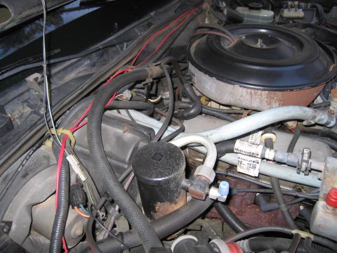 1991 Ford LTD Crown Victoria - Close-up of a car's engine bay, showing various components and wiring.